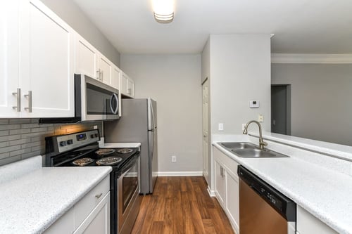 White Cabinetry And Appliances In Kitchen at Polos at Hudson Corners, Greer, South Carolina