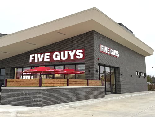Exterior photograph of the Five Guys restaurant at 5201 North May Avenue in Oklahoma City, Oklahoma.