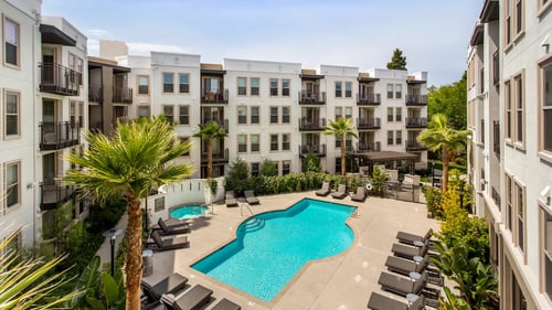 Apartment complex with pool at Cirrus Redwood City, Redwood City, CA