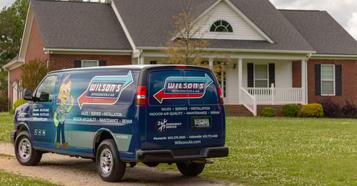 Wilson's van in front of a customer's home