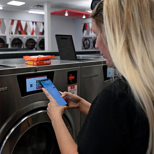 Customer using Speed Queen Laundry laundry mobile app