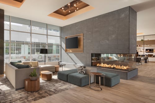 Cozy up by the fireplace in our hotel lobby.