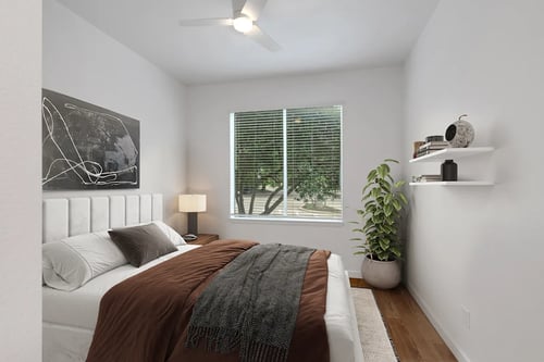 An image of a bedroom with a bed and a window at AVIA Apartments On Alpha, in Dallas, TX