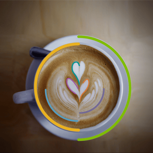 Black Baba Java Coffee Mug being held by a hand in front of a world map.