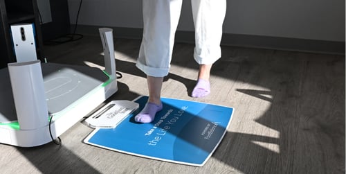 person stepping on pressure mat