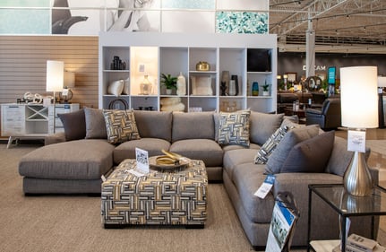 Bloomington Slumberland Furniture sectional with matching ottoman and pillows