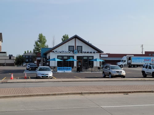 Storefront of the Caribou Coffee at 1207 19th Ave N in Fargo
