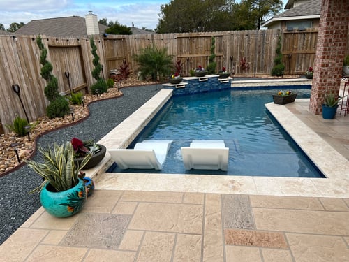 Custom pool with tanning ledge