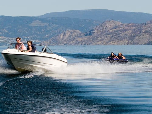 people enjoying a boat on a lake