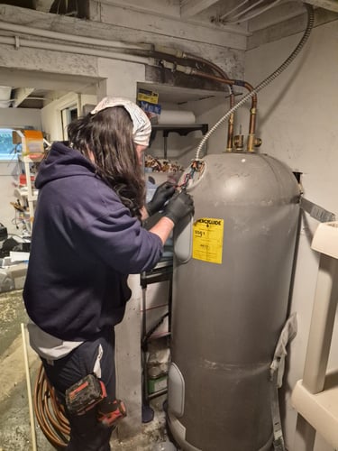 bluefrog Plumber Shae removing an old water heater