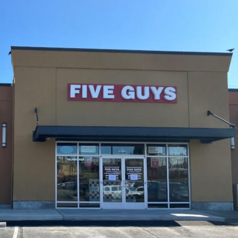 Exterior photograph of the Five Guys restaurant at 2600 Southwest Barton Street in Seattle Washington.