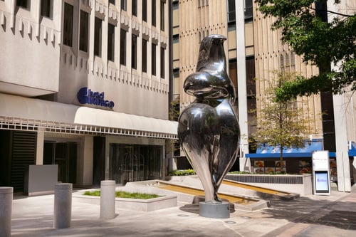 Enjoy the view of "Belle" by John Portman at the hotel entrance.