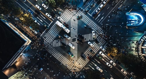 Bird's eye view of a busy city intersection.