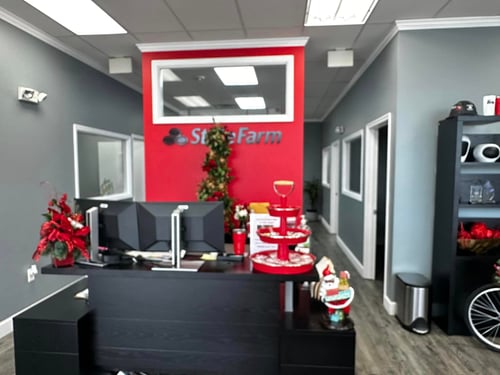 Gray and red walls with black State Farm sign and Christmas decorations