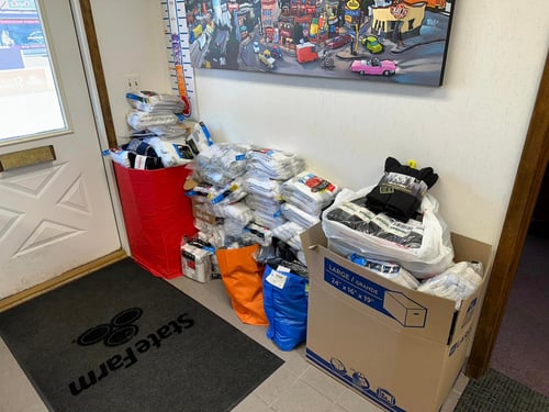 Clothes stacked up inside of agency