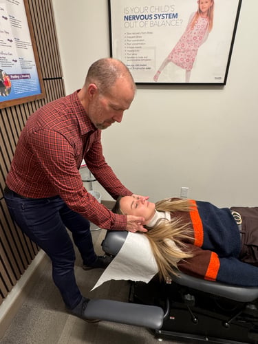 Dr. Morin adjusting patient at Summerside Chiropractic