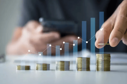 An individual stacking coins with an overlaid blue bar graph.