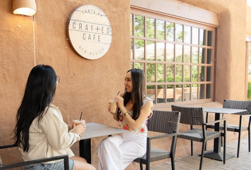 Patio at Crafted with two ladies drinking coffee