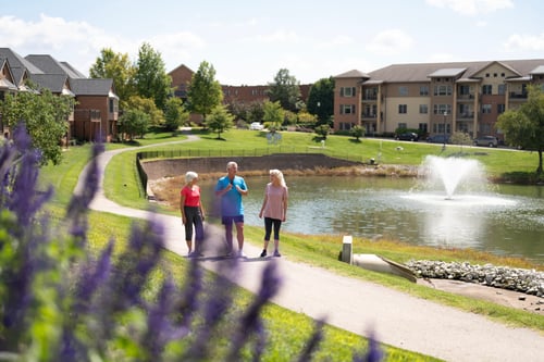 At Friendship Village, residents enjoy the beautiful landscape and paved path around the lake.