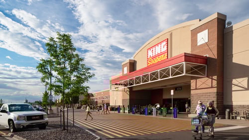 Couple with full shopping cart walking away from King Sooeprs