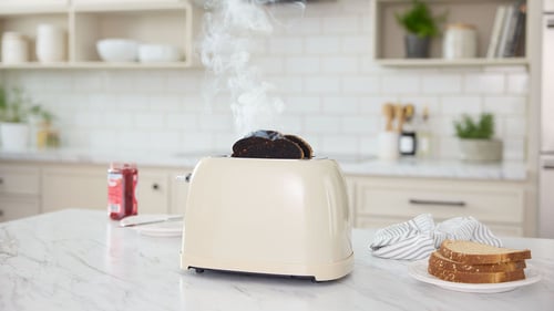 Toaster burning toast.