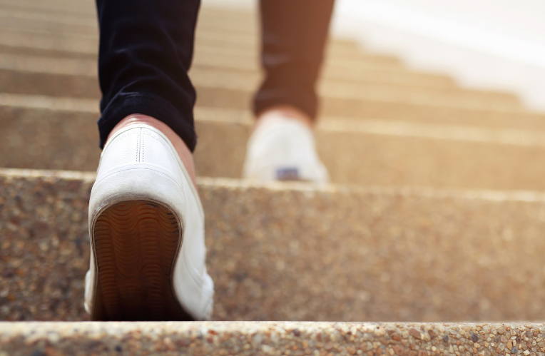 person walking up stairs