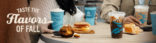 Seasonal fall beverages and bakery favorites shared at a coffeehouse table, with the headline 'Taste the Flavors of Fall'.