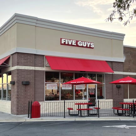 An exterior photograph of the Five Guys restaurant at 128 Rolling Hills Circle in Easley South Carolina.