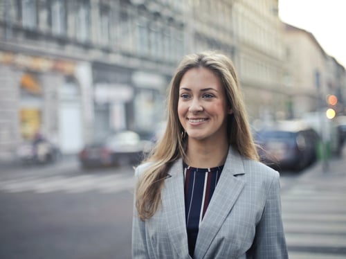 A business woman walking on the street.