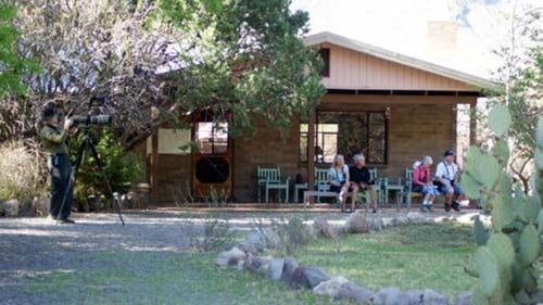lodging ranch with guest sitting outside