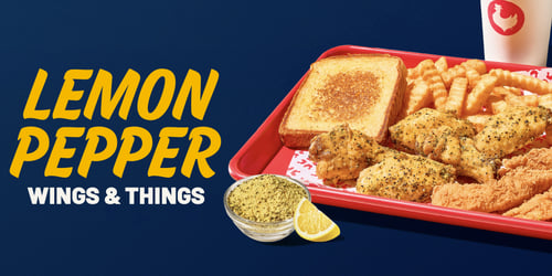 Zaxbys Lemon Pepper Wings & Things Meal with lemon pepper chicken wings, chicken fingers, texas toast, fries, and a cup with the Zaxbys logo served with lemon  pepper seasoning and a lemon.
