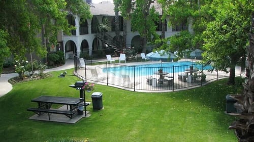 lush grass exterior landscaping at barcelona apartments in Visalia, CA
