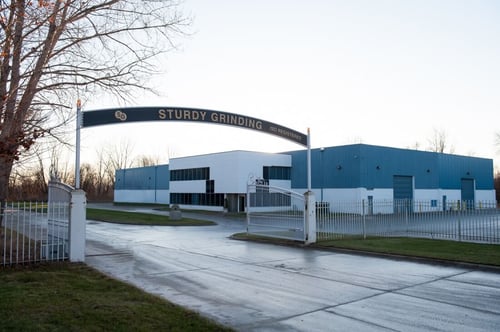 outside picture of blue industrial buildings and facilities.