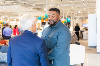 Sunset Hills Slumberland Furniture owners shaking hands