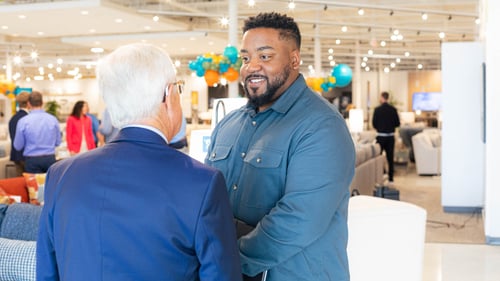 Sunset Hills Slumberland Furniture owners shaking hands