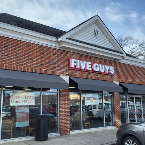 Exterior photograph of the Five Guys restaurant at 35 Merrick Road in Amityville New York.