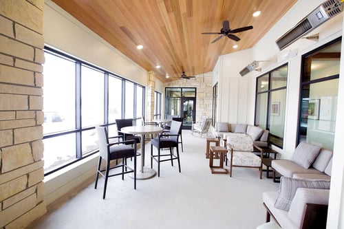 Off the main entrance of the Gathering Place, a three-season screened-in patio offers radiant heat from the ceiling to make it a pleasant place to relax even on cold days.