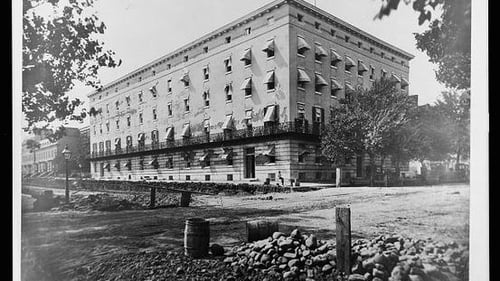 large brick building in black and white