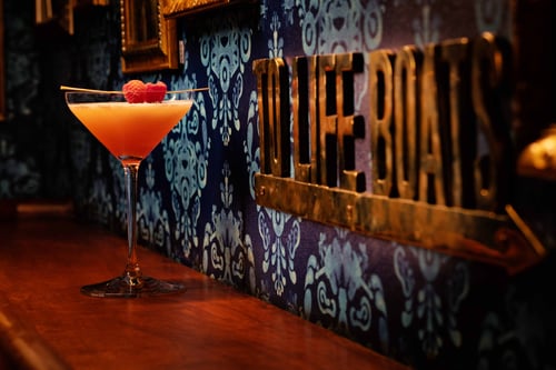 Specialty cocktail inside of Pier 17 Yacht Club by Spiegelworld