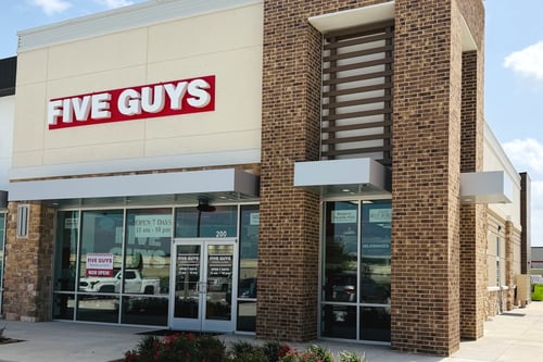 Exterior photograph of the Five Guys restaurant at 11115 West Grand Parkway South in Richmond, Texas.