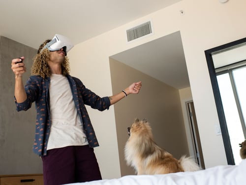 Man in bedroom using multi-gig internet for virtual reality