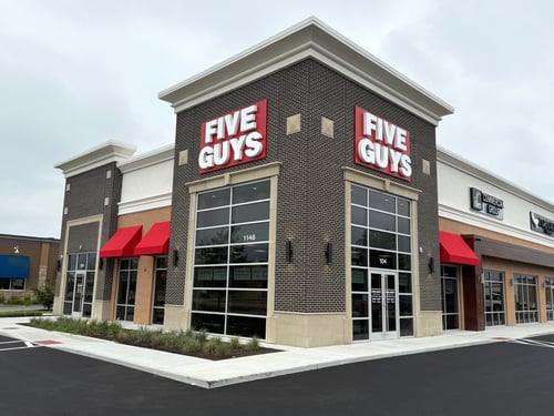 Exterior photograph of the Five Guys restaurant at 1146 North Emerson Avenue in Greenwood, Indiana.