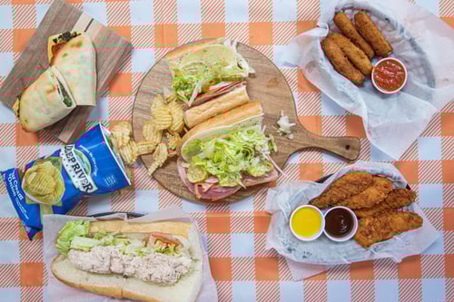 our food spread out on a picnic table