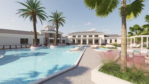 A large swimming pool with palm trees at The Quinn, Pensacola, Florida
