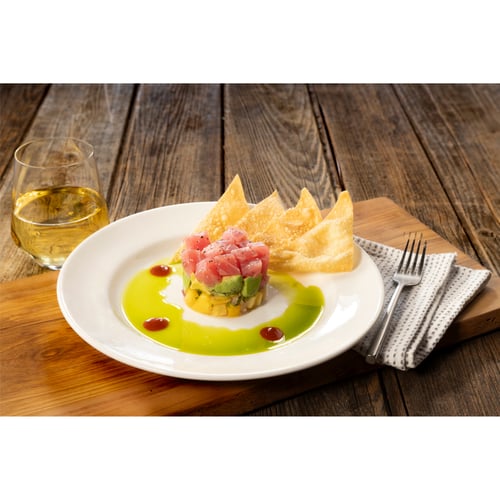 Ahi tuna, avocado, mango & pineapple stack with cilantro oil and wonton crisps on the side