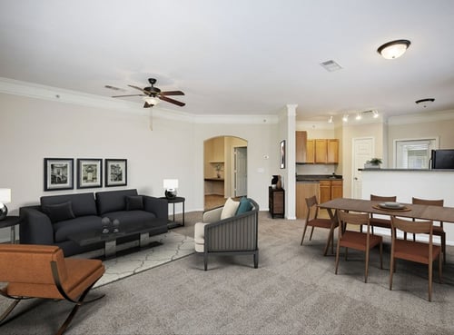 Living Room With Kitchen View at Villas at Carrington Square in Overland Park, KS