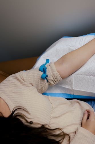 IV infusion treatment in progress in a calm, wellness-focused clinic room.