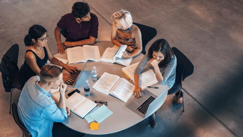 group of students studying at a table