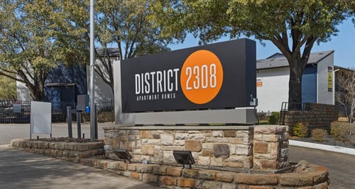 the sign for district 2400 in front of a building at District 2308, Arlington, TX