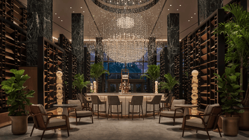 Luxurious hotel bar with a grand chandelier, marble columns, elegant seating, and shelves filled with decor. Large potted plants add a touch of greenery to the space.